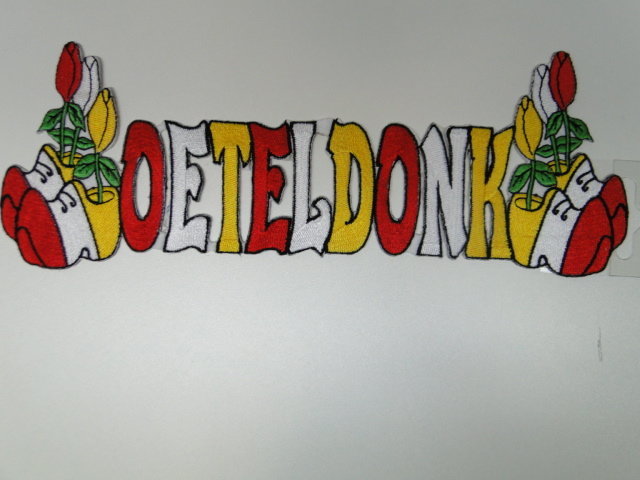Oetel embleem, Tekst Oeteldonk beide zijde klompen met tulpen